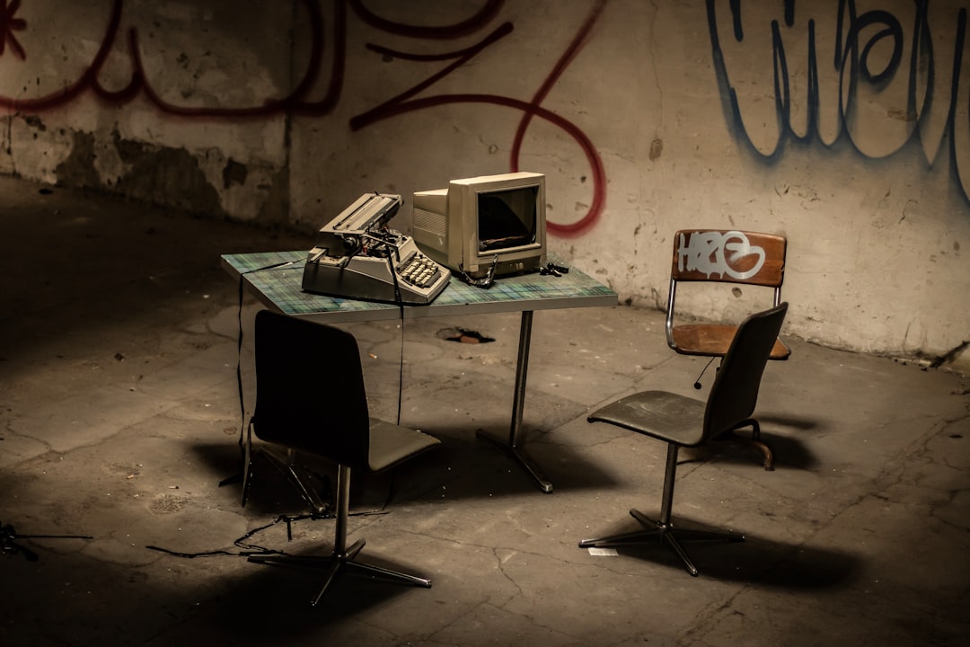 white laptop computer on table