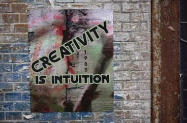 a sign on a brick wall that says creativity is institution