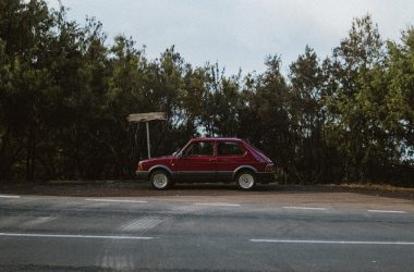 a red car parked on the side of the road