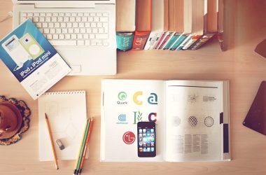 pencils and smartphone on top of books