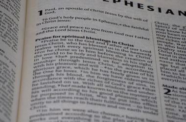 A close up of an open book with the word ephesian on it