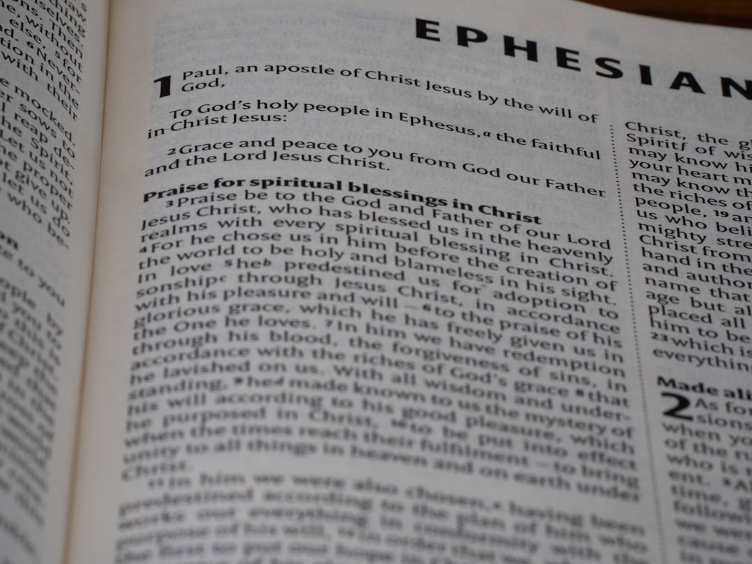 A close up of an open book with the word ephesian on it