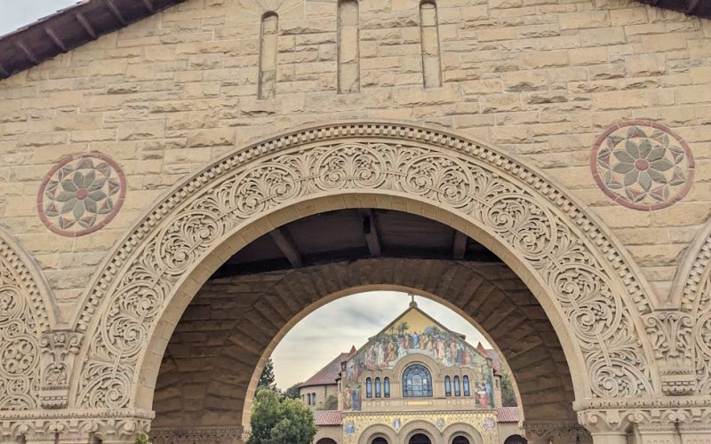 a large stone building with a clock on it's side