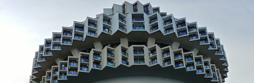 a very tall building with many windows and balconies