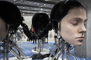 A group of mannequins with headphones on