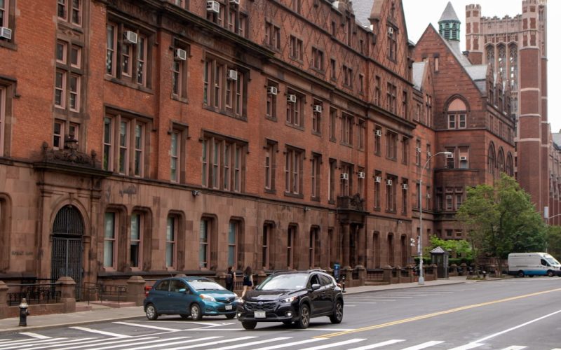 A city street with cars parked on the side of it