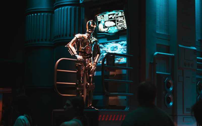 a man standing on a stage in front of a crowd of people