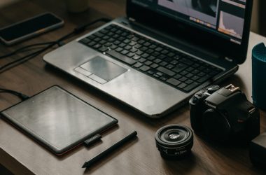 a laptop computer sitting on top of a wooden desk