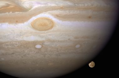 a large white ball with two smaller planets in the background