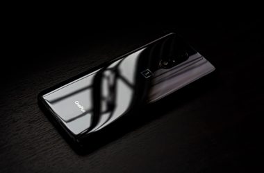 black android smartphone on brown wooden table