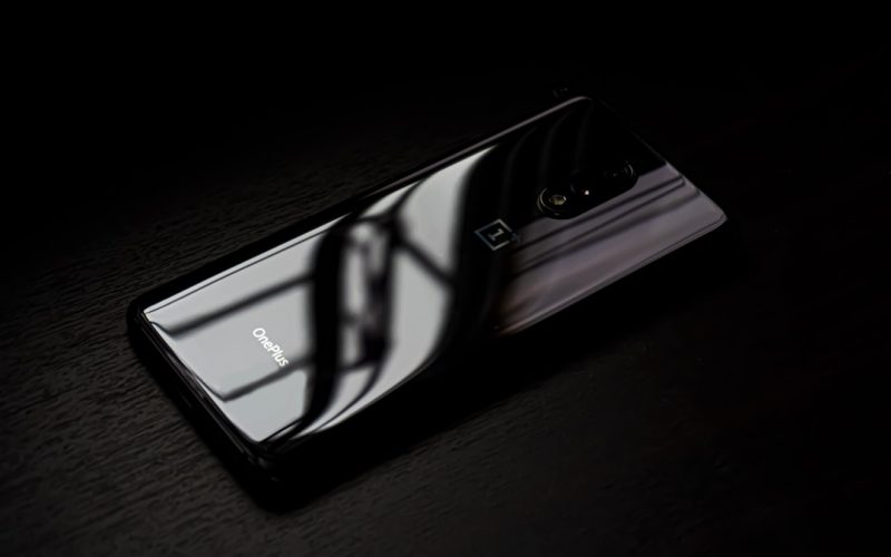 black android smartphone on brown wooden table