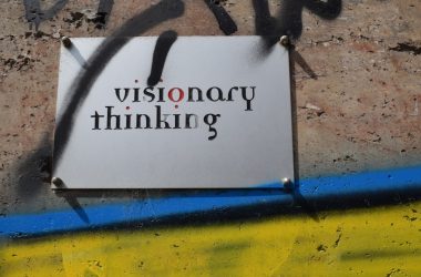 a sign that is on the side of a wall