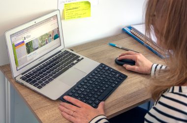 macbook air on brown wooden table