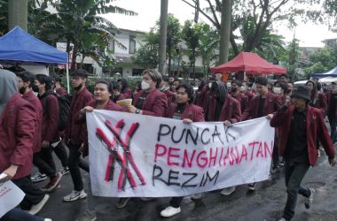 a group of people marching with a banner