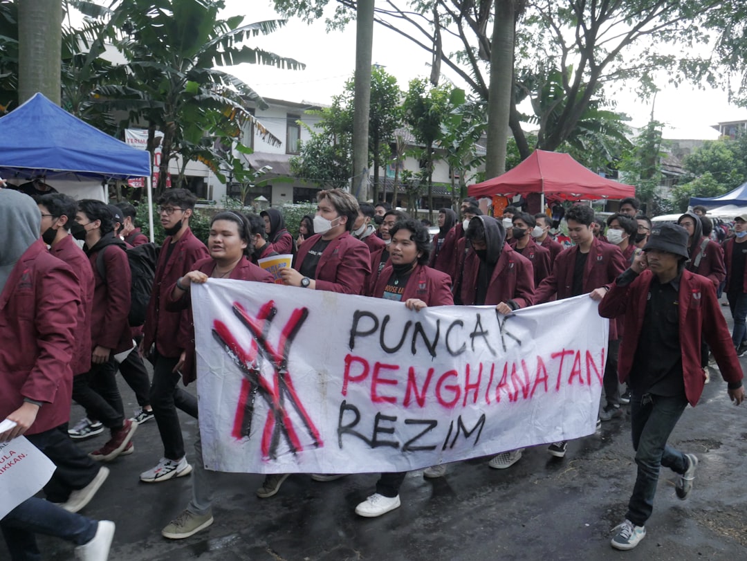 a group of people marching with a banner